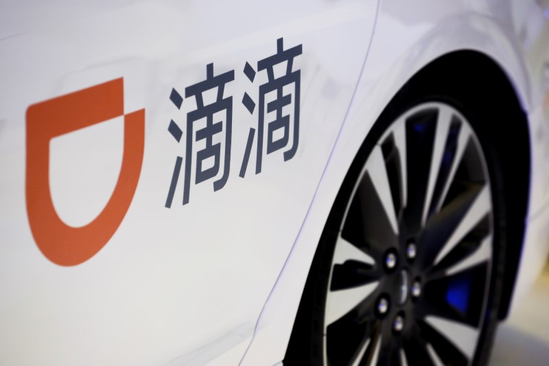 FILE PHOTO: The company logo of the Didi ride-hailing app on a car door at the IEEV New Energy Vehicles Exhibition in Beijing