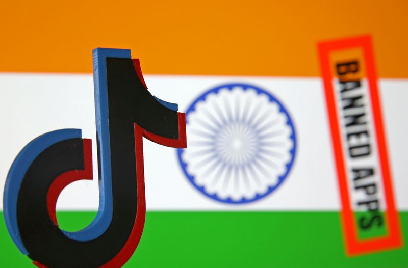 FILE PHOTO: A 3d printed Tik Tok logo is seen in front of a displayed Indian flag and a