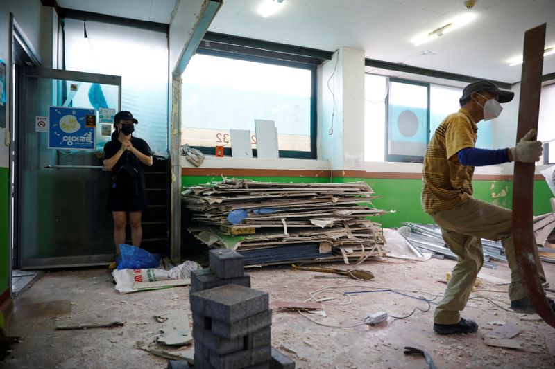 Kim Da-eun who used to run a private institute, takes photographs of her private institute that is currently torn down in Anseong