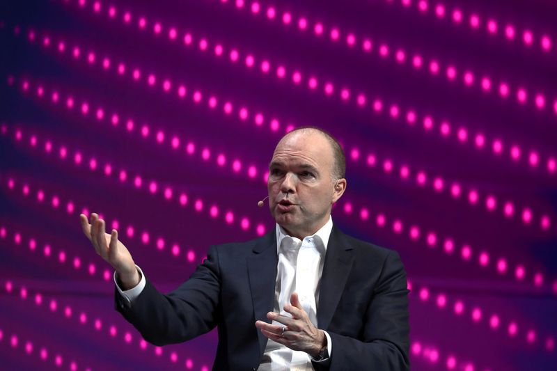 FILE PHOTO: Nick Read, CEO of Vodafone, gestures as he speaks during the Mobile World Congress in Barcelona