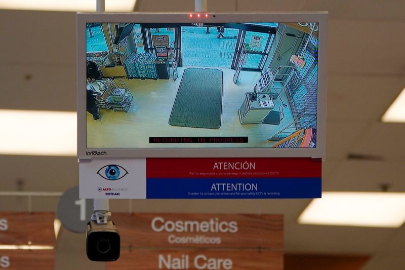 A facial recognition camera is shown pointed at the entrance of a Rite Aid store in downtown Los Angeles