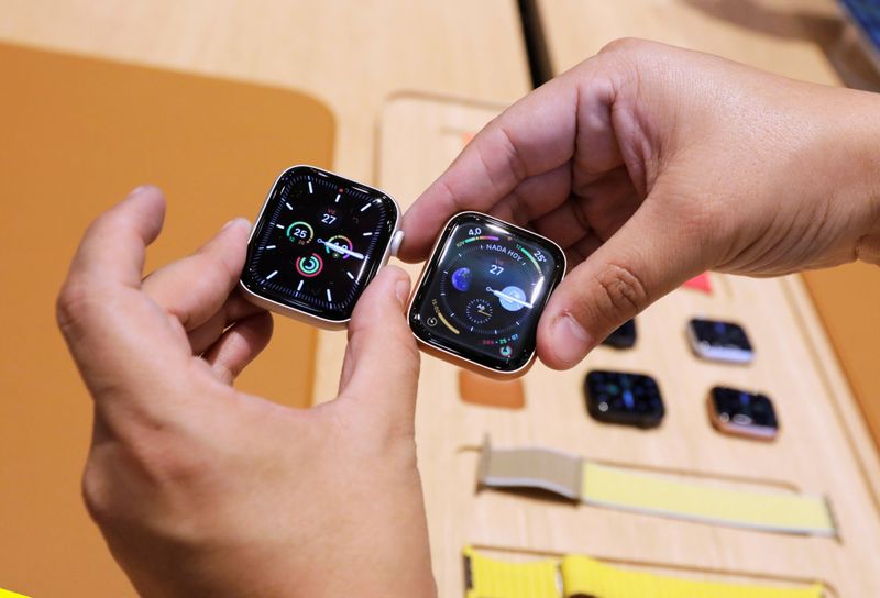FILE PHOTO: A man shows the new model of Apple Watch during the opening of Mexico's first flagship Apple store at Antara shopping mall in Mexico City