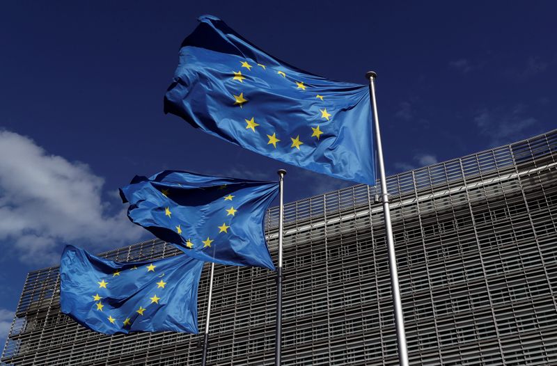European Union flags flutter outside the European Commission headquarters in Brussels