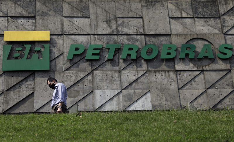 A man walks past the headquarters of Brazilian oil company Petrobras in Rio de Janeiro