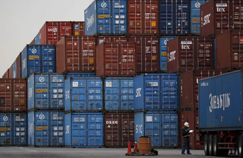 A laborer works in a container area at a port in Tokyo