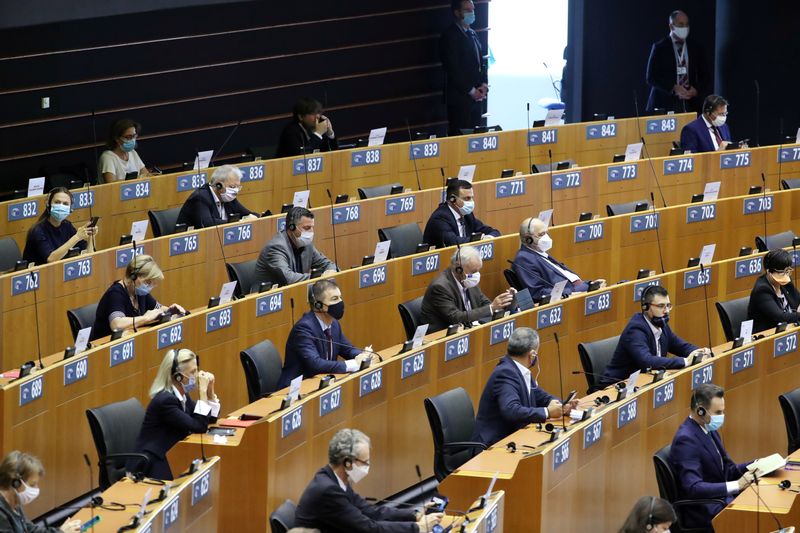 FILE PHOTO: Members of the European Parliament wait for the start of a plenary session in Brussels