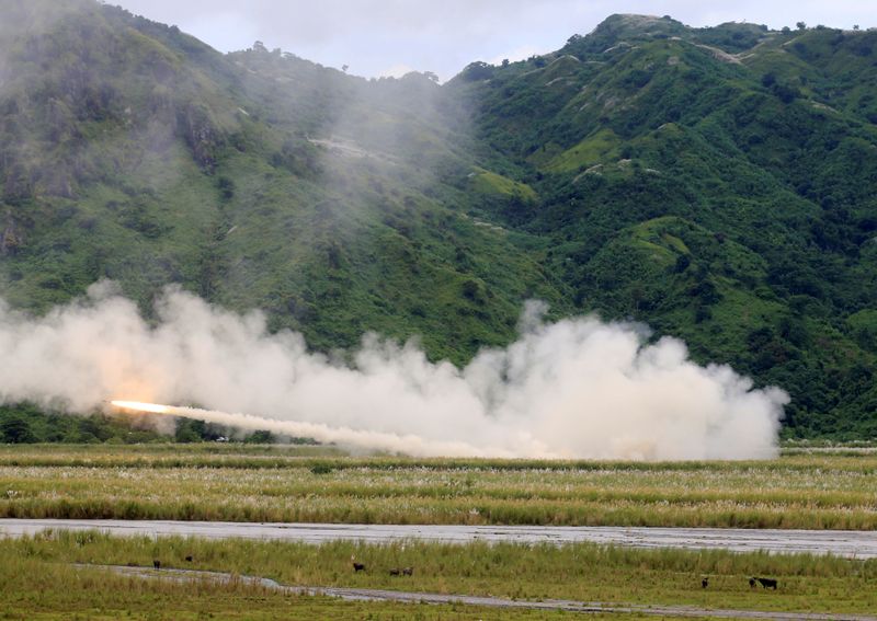 FILE PHOTO: U.S. military forces fire a High Mobility Artillery Rocket System (HIMARS) rocket during the annual Philippines-US live fire amphibious landing exercise (PHIBLEX) at Crow Valley, Tarlac province
