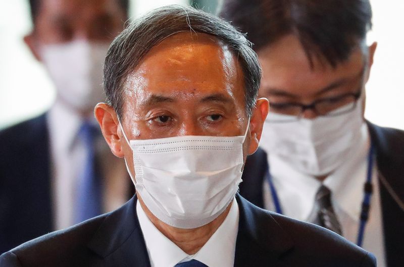 Japan's newly-elected Prime Minister Yoshihide Suga arrives at his official residence in Tokyo