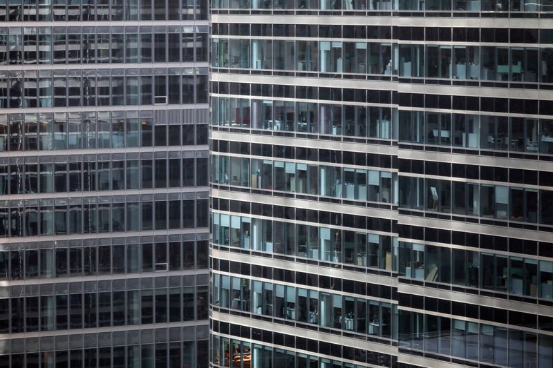 S&P office is seen at right in Canary Wharf in London