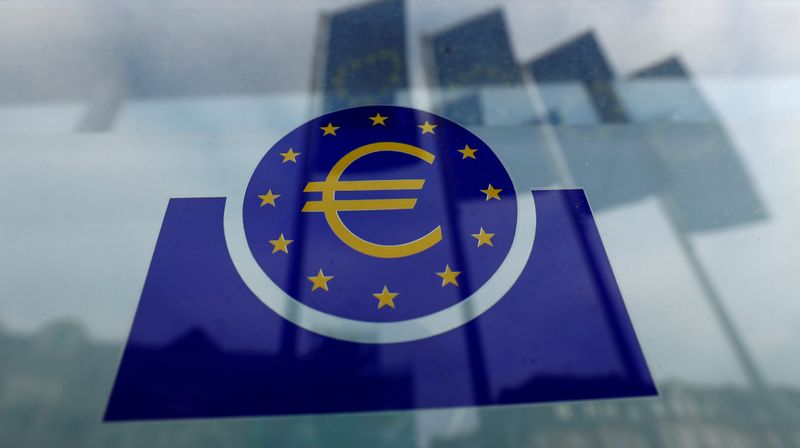 FILE PHOTO: Specialists work on a crane in front of the European Central Bank (ECB) in Frankfurt