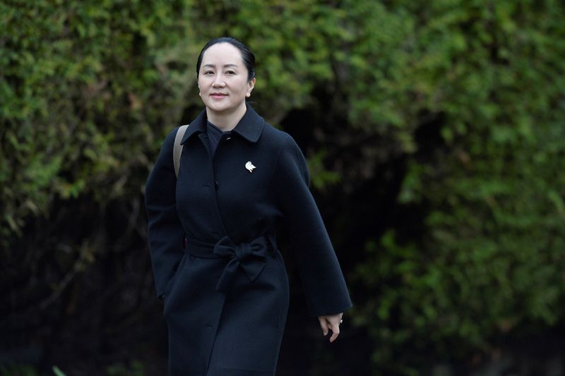 FILE PHOTO: Huawei CFO Meng leaves her home to attend her extradition hearing in Vancouver