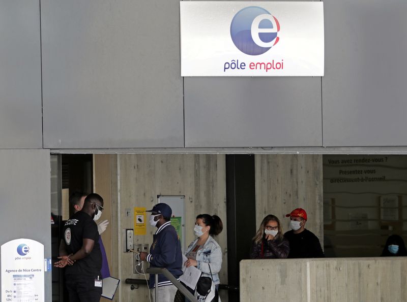 Job seekers, wearing protective face masks, visit a National Agency for Employment office in Nice