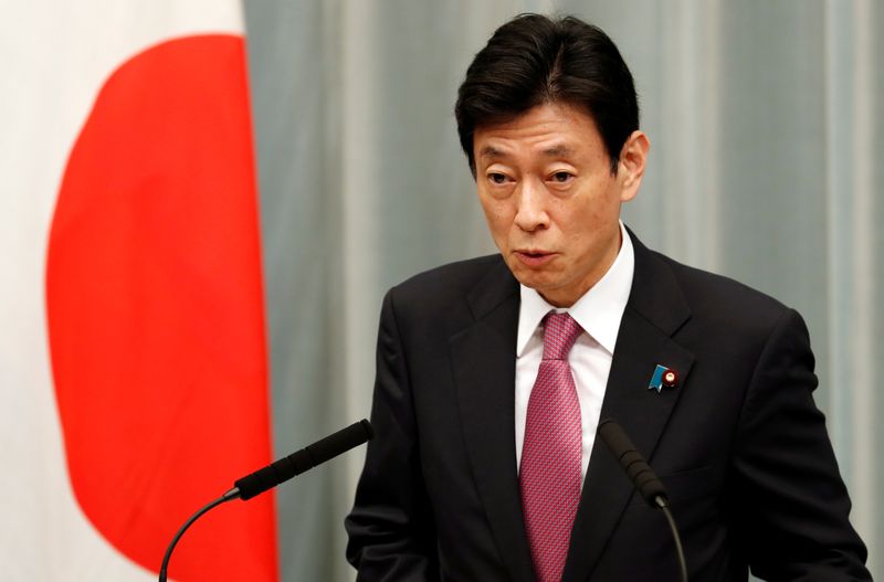 Japan's Minister in charge of economic revitalisation and measures for the novel coronavirus pandemic Yasutoshi Nishimura attends a news conference in Tokyo