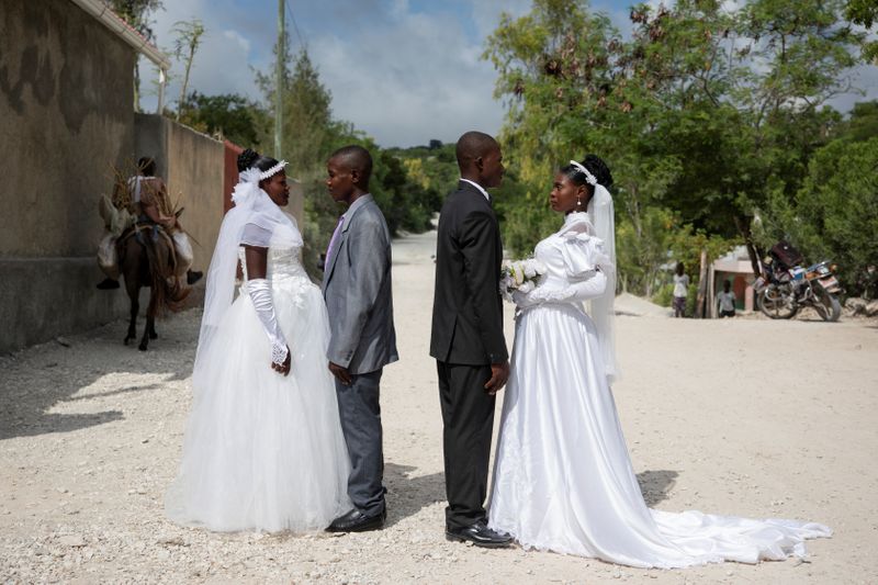 The Wider Image: Haiti's brides beat hurricanes, power cuts and protests to wed in style