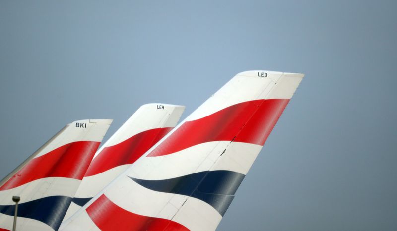 FILE PHOTO: FILE PHOTO: British Airways logos are seen on tail fins at Heathrow Airport in west London