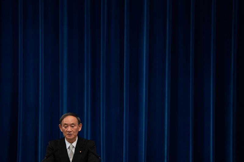 Yoshihide Suga speaks during a news conference following his confirmation as Prime Minister of Japan in Tokyo