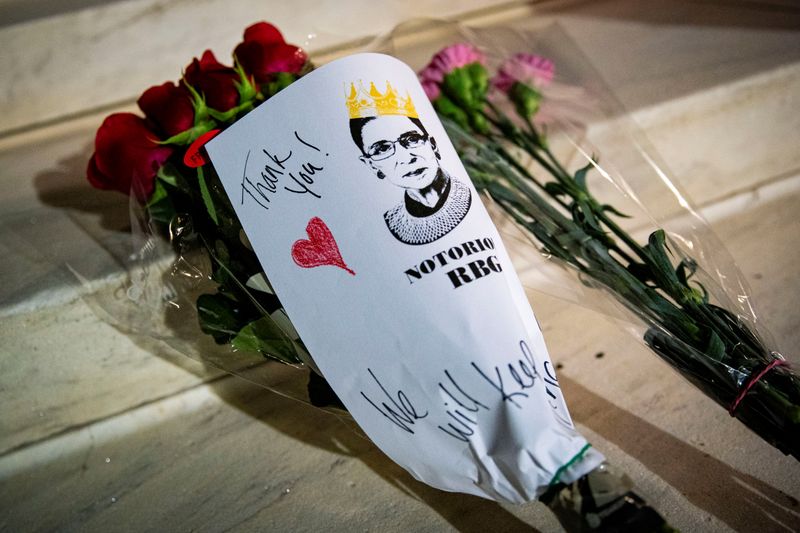 FILE PHOTO: A bouquet of flowers is left outside of the U.S. Supreme Court following the death of U.S. Supreme Court Justice Ruth Bader Ginsburg, in Washington