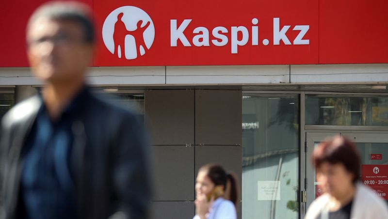 FILE PHOTO: The Kaspi Bank logo in seen at the bank's branch in Almaty