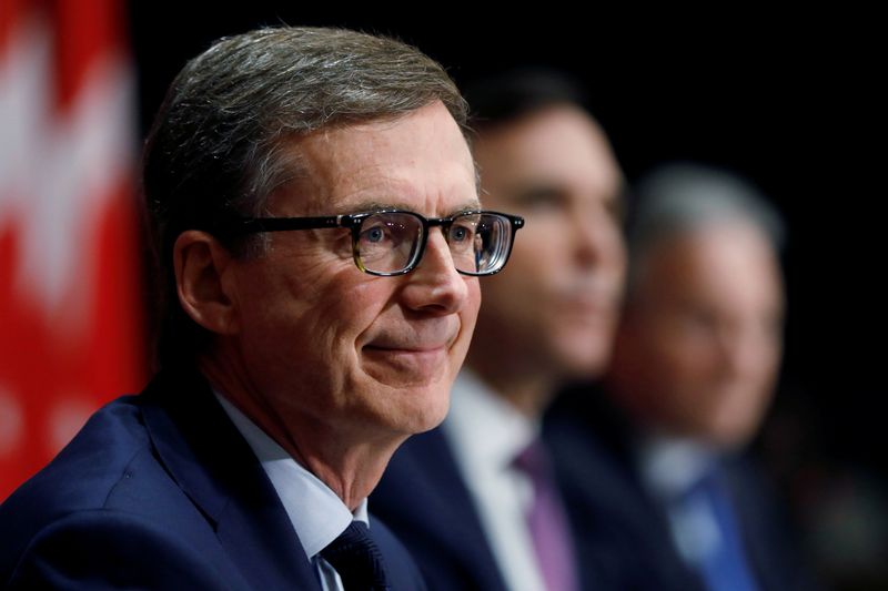 FILE PHOTO: Bank of Canada governor designate Tiff Macklem attends a news conference with Canada's Minister of Finance Bill Morneau and current Bank of Canada governor Stephen Poloz on Parliament Hill in Ottawa