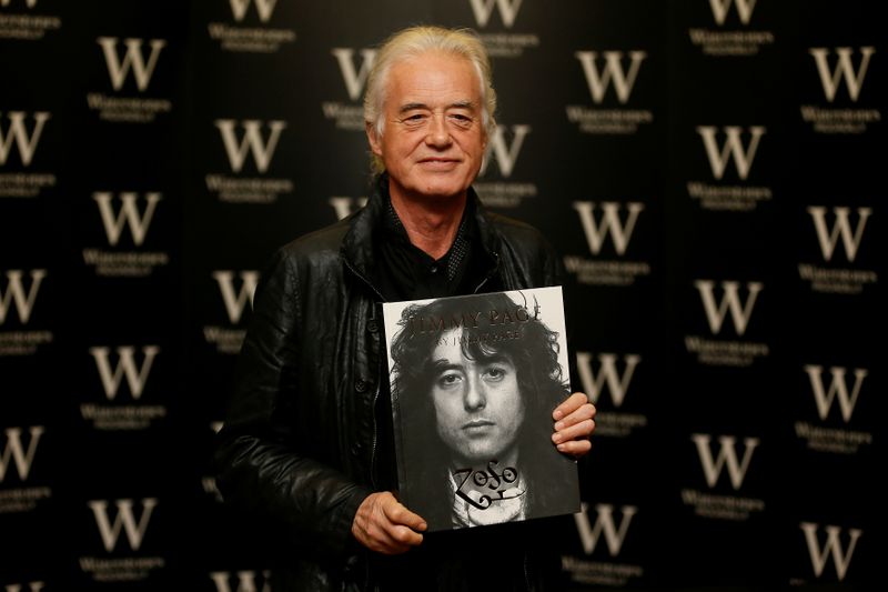 FILE PHOTO: Guitarist Jimmy Page of rock band Led Zeppelin poses for photographers during a book signing for his book