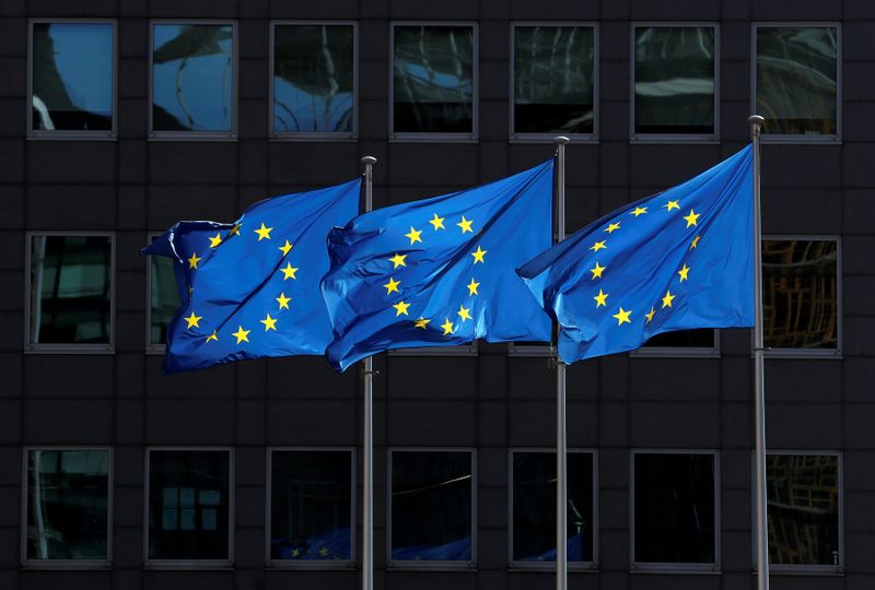 European Union flags flutter outside the European Commission headquarters in Brussels