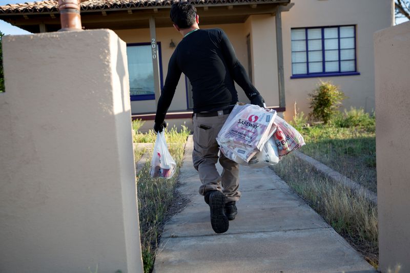 FILE PHOTO: Instacart employee Eric Cohn works amid the coronavirus outbreak