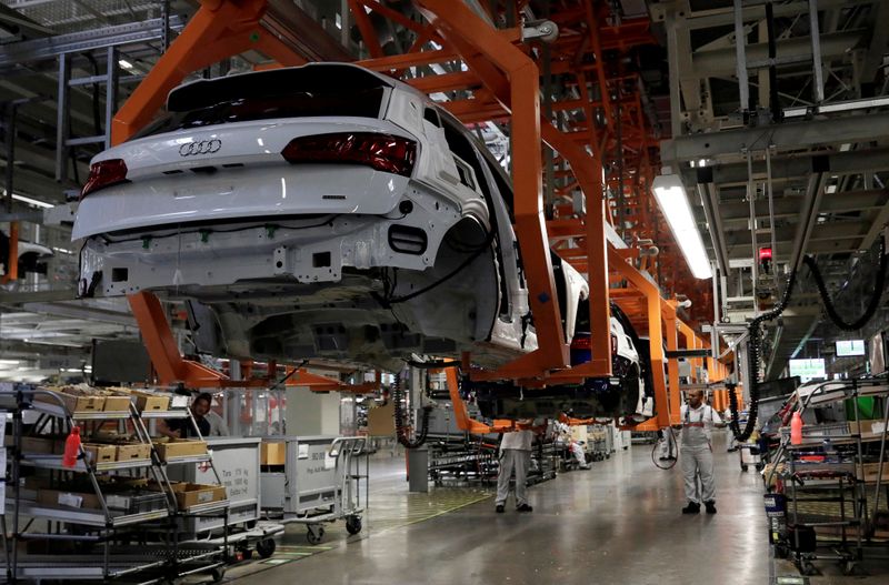 FILE PHOTO: Employees work at an Audi Q5 2.0 production line of the German car manufacturer's plant during a media tour in San Jose Chiapa