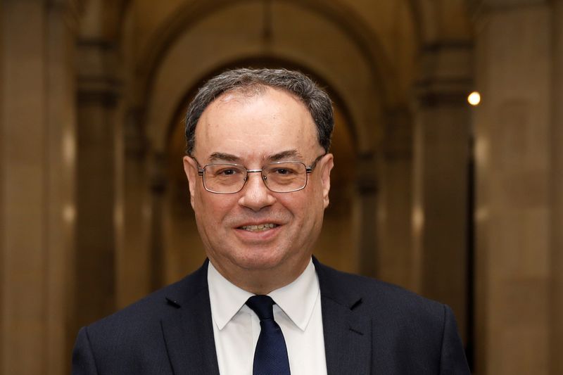 FILE PHOTO: Bank of England Governor Andrew Bailey poses for a photograph on the first day of his new role at the Central Bank in London