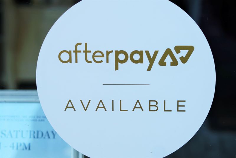A logo for the company Afterpay is seen in a store window in Sydney