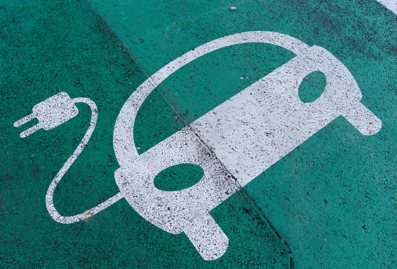 FILE PHOTO: A sign is pictured on an electric car charging station at the United Nations in Geneva