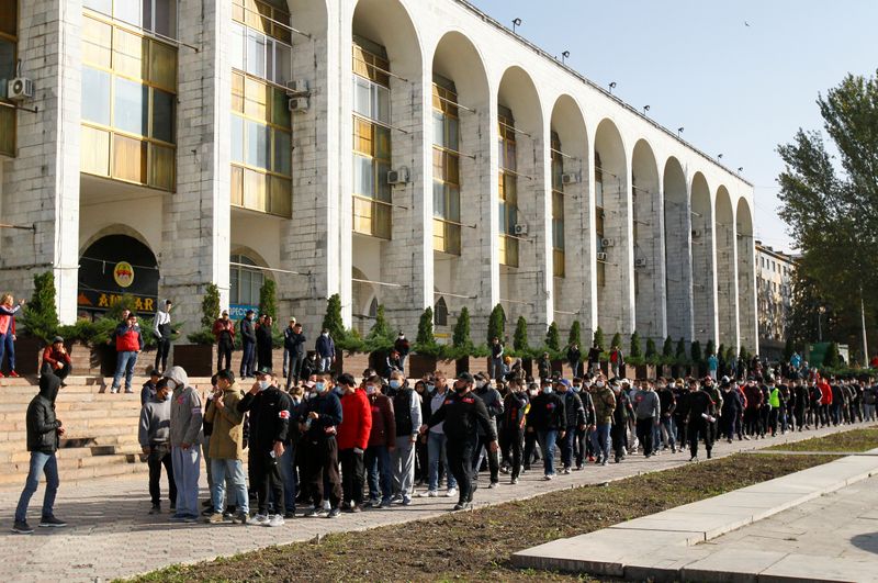 FILE PHOTO: Members of the voluntary people's patrol walk in Ala-Too Square in Bishkek
