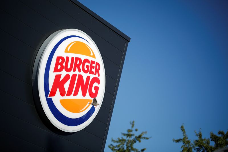 The Burger King company logo stands on a sign outside a restaurant in Bretigny-sur-Orge, near Paris