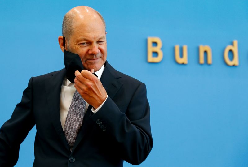FILE PHOTO: German Finance Minister Olaf Scholz presents the federal government's 2021 draft budget, in Berlin
