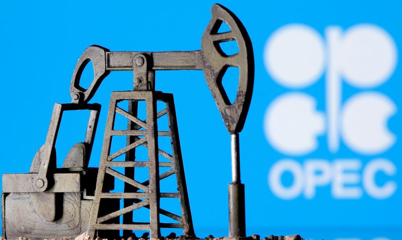 FILE PHOTO: A 3D printed oil pump jack is seen in front of displayed OPEC logo in this illustration picture