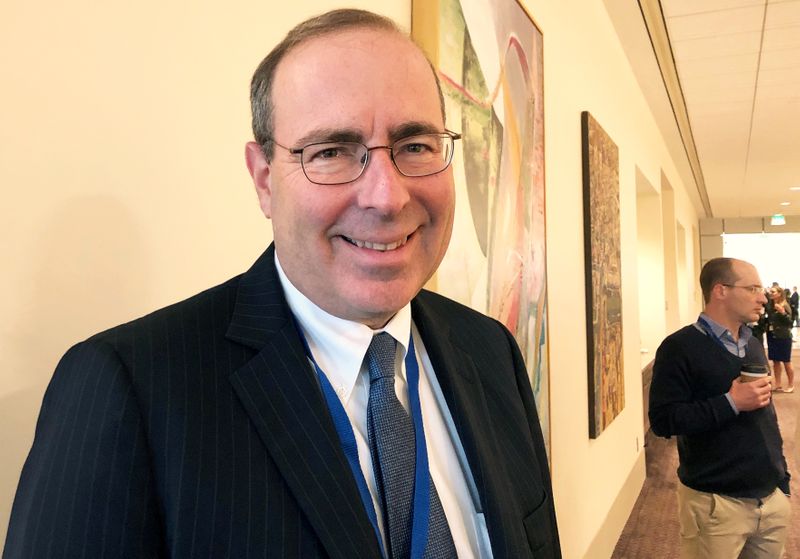FILE PHOTO: FILE PHOTO: Federal Reserve Bank of Richmond President Thomas Barkin poses during a break at a Dallas Fed conference on technology in Dallas