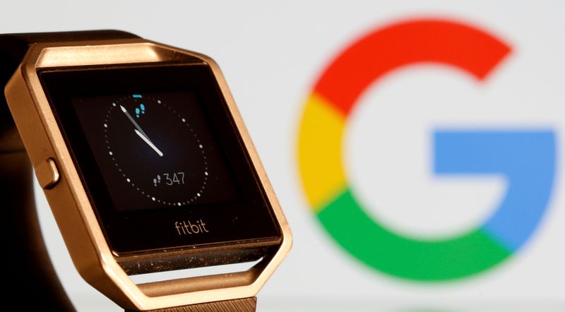 FILE PHOTO: Fitbit Blaze watch is seen in front of a displayed Google logo in this illustration