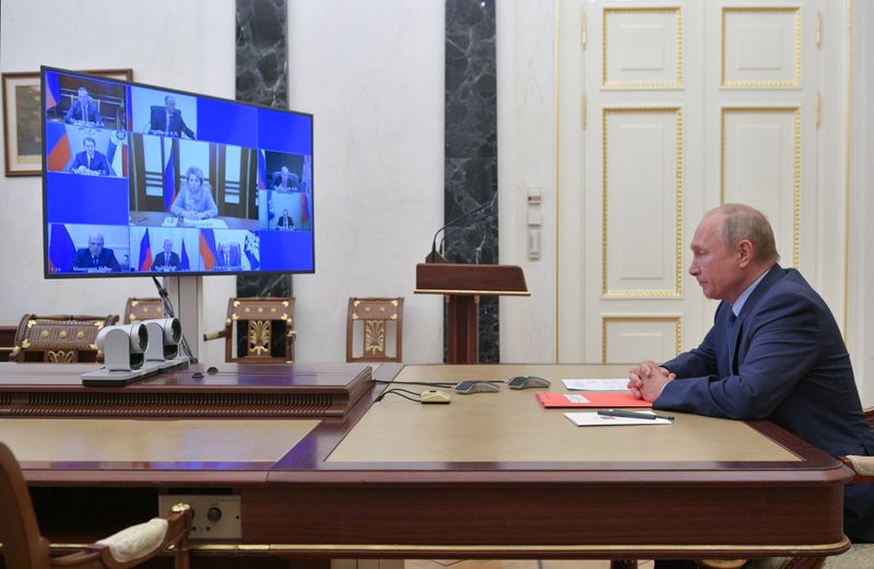 Russia's President Putin takes part in a video conference call with members of the Security Council in Moscow