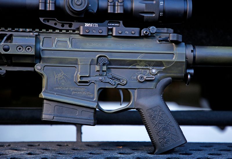 A detailed view of the trigger assembly, markings and finish of a fully assembled rifle using the 6.5 Creedmoor cartridge is seen at Spike's Tactical LLC, a gunmaker in Apopka