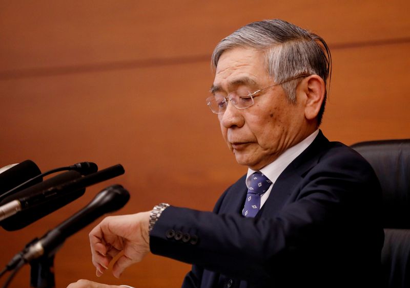 FILE PHOTO: Bank of Japan Governor Haruhiko Kuroda attends a news conference in Tokyo