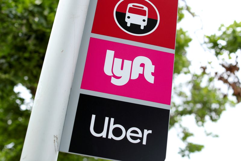 FILE PHOTO: FILE PHOTO: A sign marks a rendezvous location for Lyft and Uber users at San Diego State University in San Diego