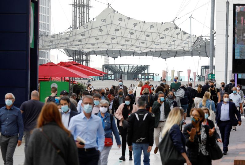 Masked people at financial and business district of La Defense