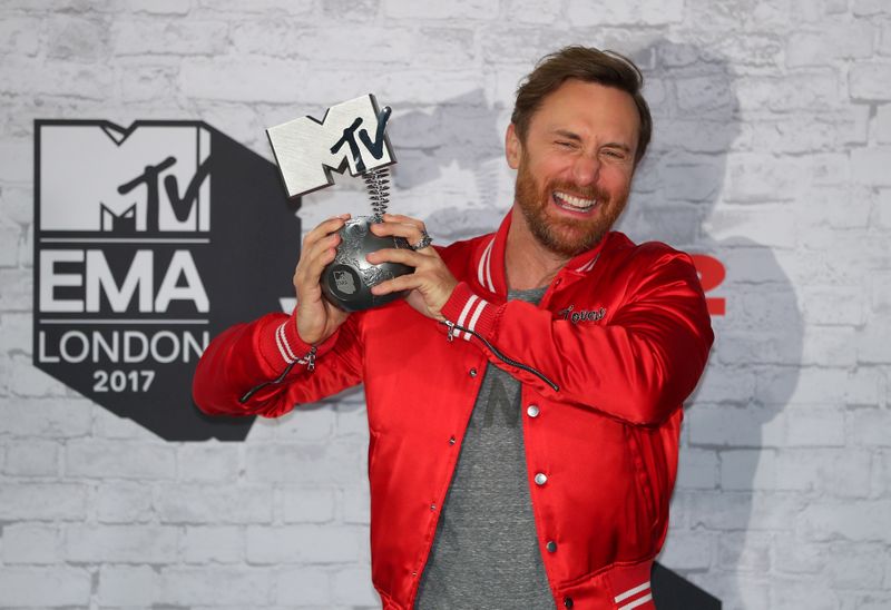 FILE PHOTO: French DJ David Guetta poses with his award during the 2017 MTV Europe Music Awards at Wembley Arena in London