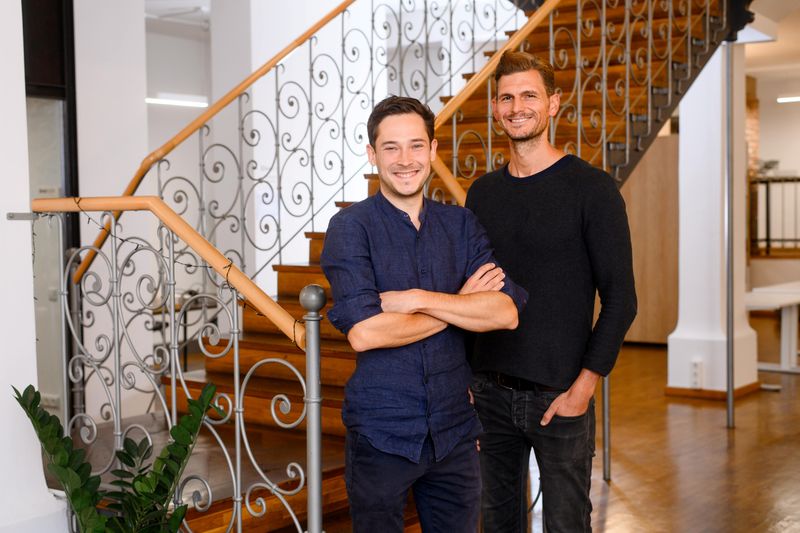 Limehome co-founders Lars Staebe (L) and Josef Vollmayr (R) pose for a photo in the company's headquarters in Munich
