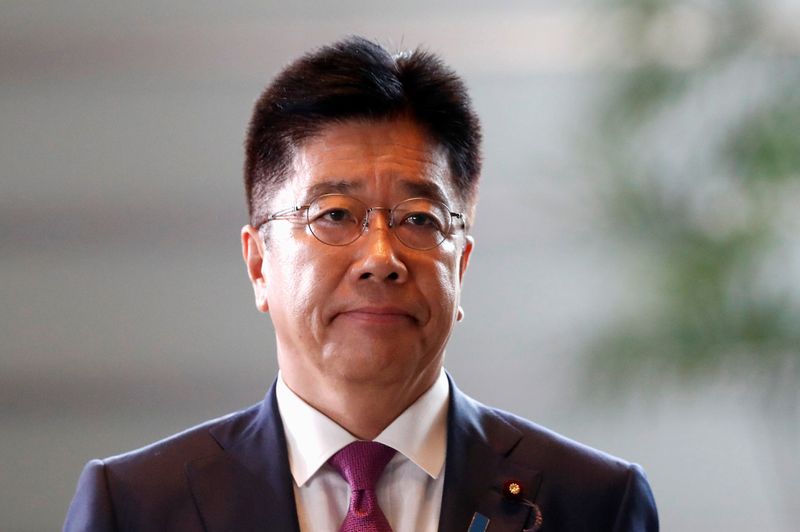 Japan's new Health, Labour and Welfare Minister Katsunobu Kato arrives at Prime Minister Shinzo Abe's official residence in Tokyo