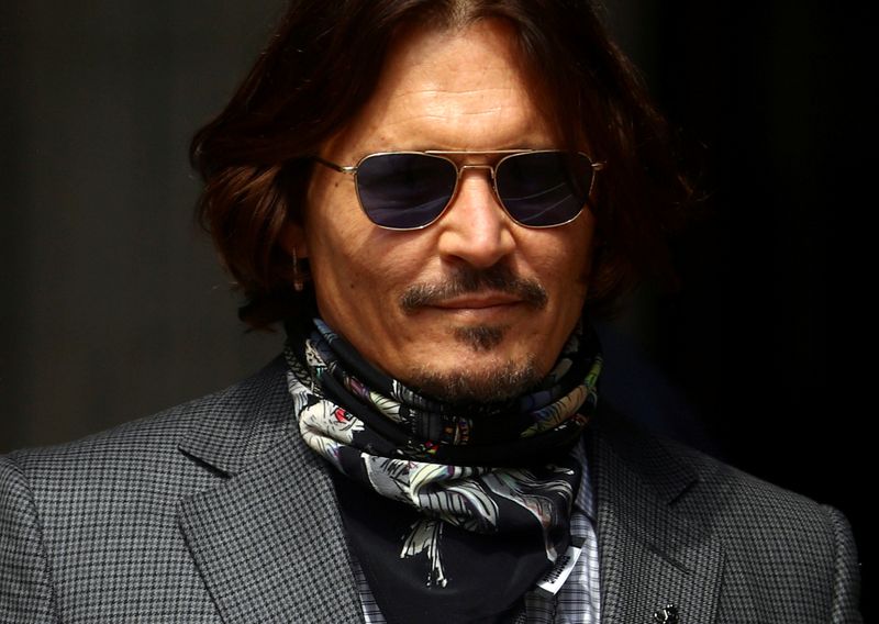 FILE PHOTO: Actors Amber Heard and Johnny Depp at the High Court in London