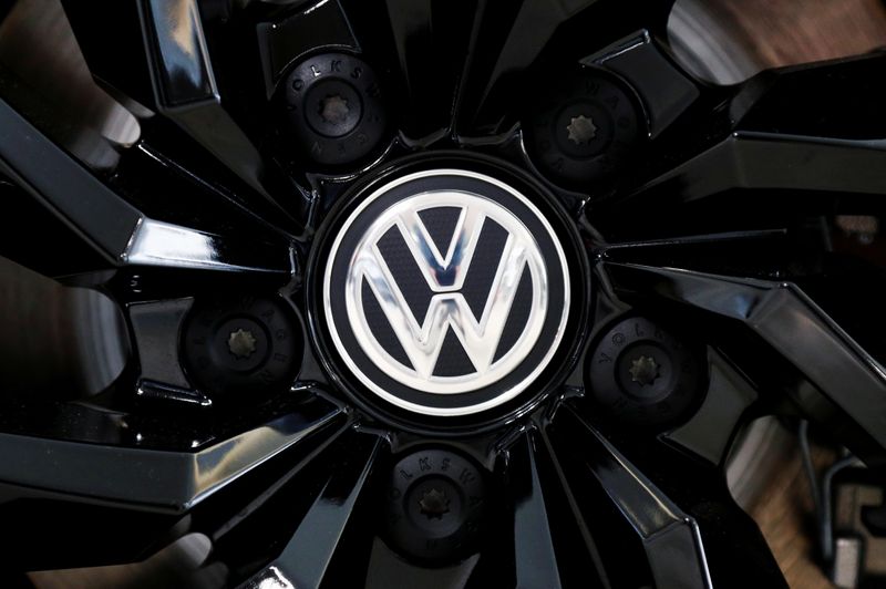 FILE PHOTO: The logo of German carmaker Volkswagen is seen on a rim cap in a showroom of a Volkswagen car dealer in Brussels