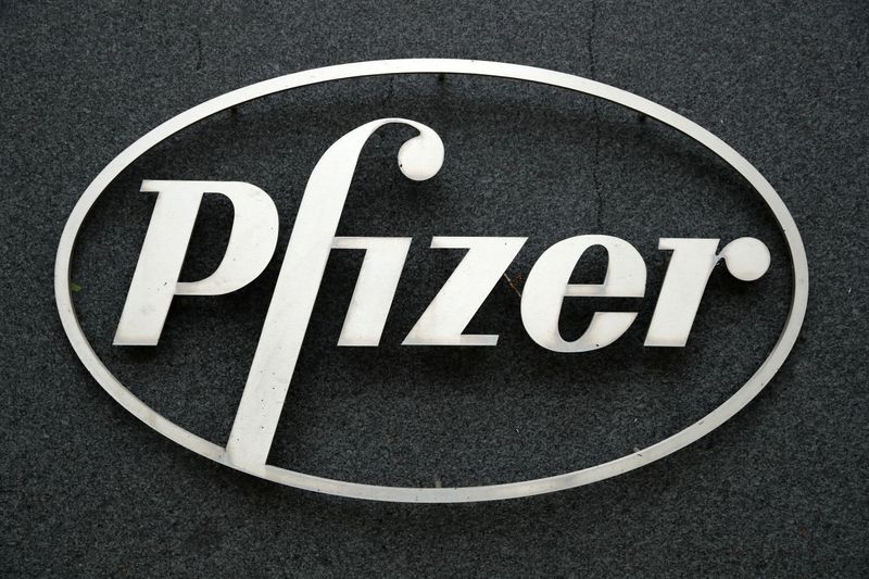 The Pfizer logo is seen at their UK commercial headquarters in Walton Oaks