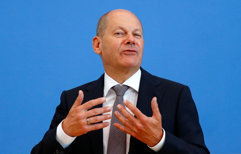 FILE PHOTO: German Finance Minister Olaf Scholz presents the federal government's 2021 draft budget, in Berlin