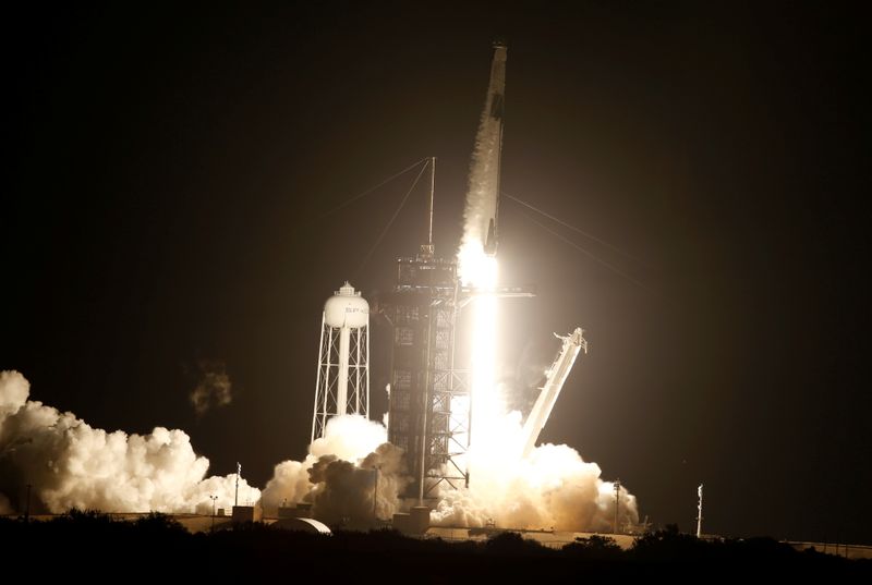 A SpaceX Falcon 9 rocket, with the Crew Dragon capsule, is launched carrying four astronauts on the first operational NASA commercial crew mission at Kennedy Space Center in Cape Canaveral, Florida