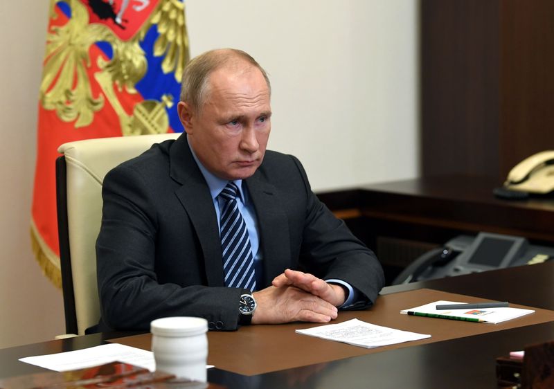 Russian President Vladimir Putin attends a meeting on a humanitarian mission in the region of Nagorno-Karabakh outside Moscow